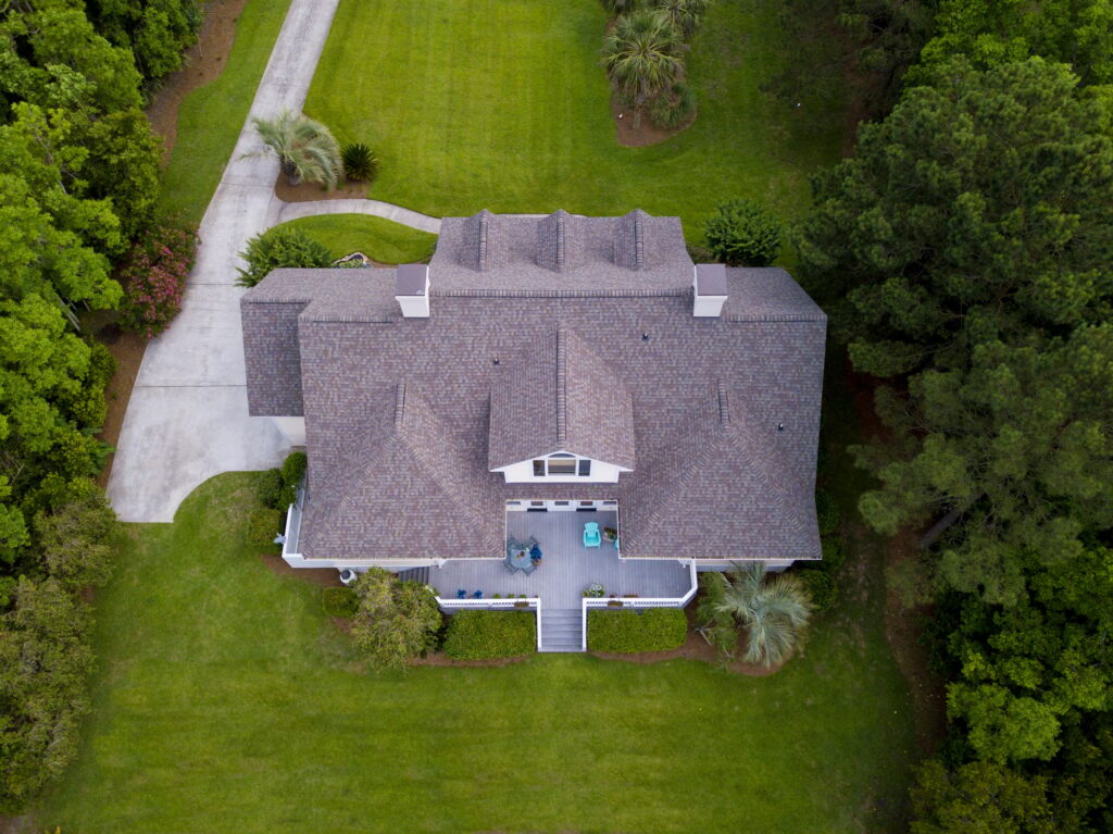 Aerial view of large home with shingle roof done by ASAP Roofing Contractor